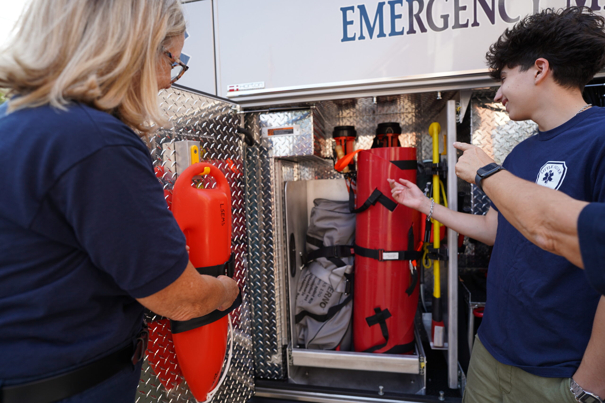 Little Silver EMS volunteers looking at equipment in the vehicle
